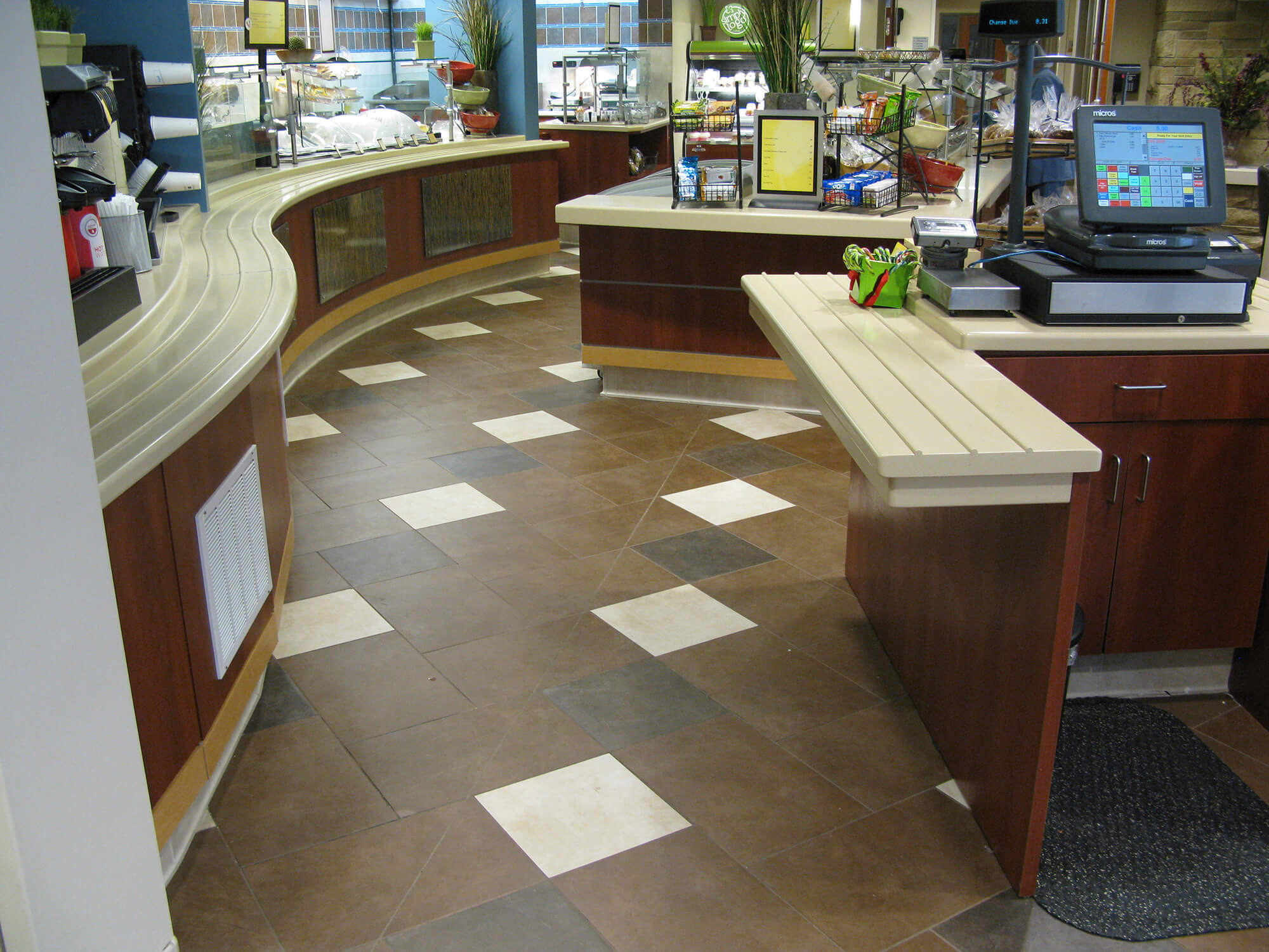 Commercial tile installation in a food service area designed for heavy traffic and cleaning